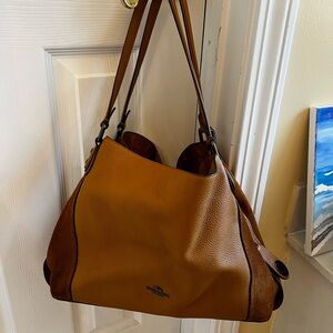 Coach tan color leather purse with suede on the sides. Barely used